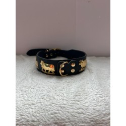 Collier noir avec des vaches dorées 2ème main